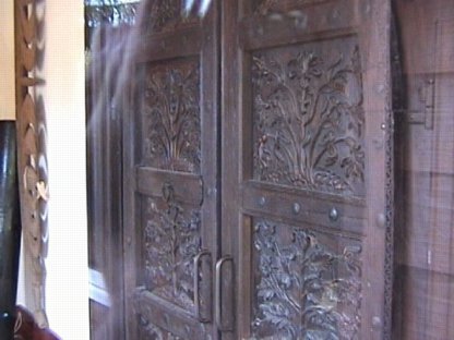 Impressive Wooden Door Welcomes You Inside