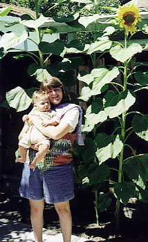 Julie shows off Riley and the sunflowers